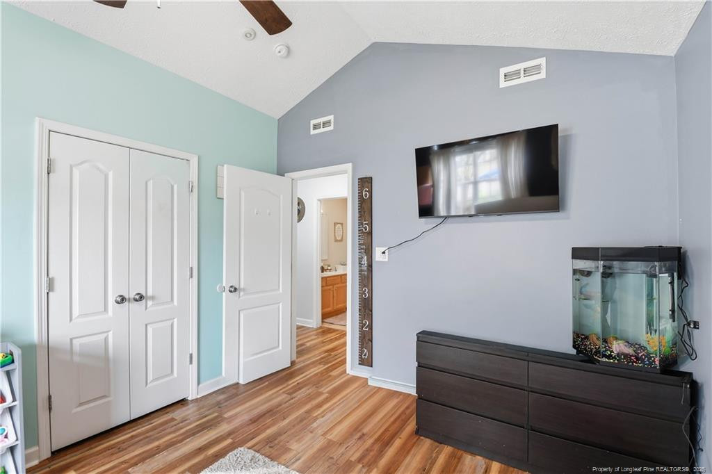 212 Lennox Loop Raeford, NC 28376 - Photo 20 of 47 a living room with furniture and a flat screen tv