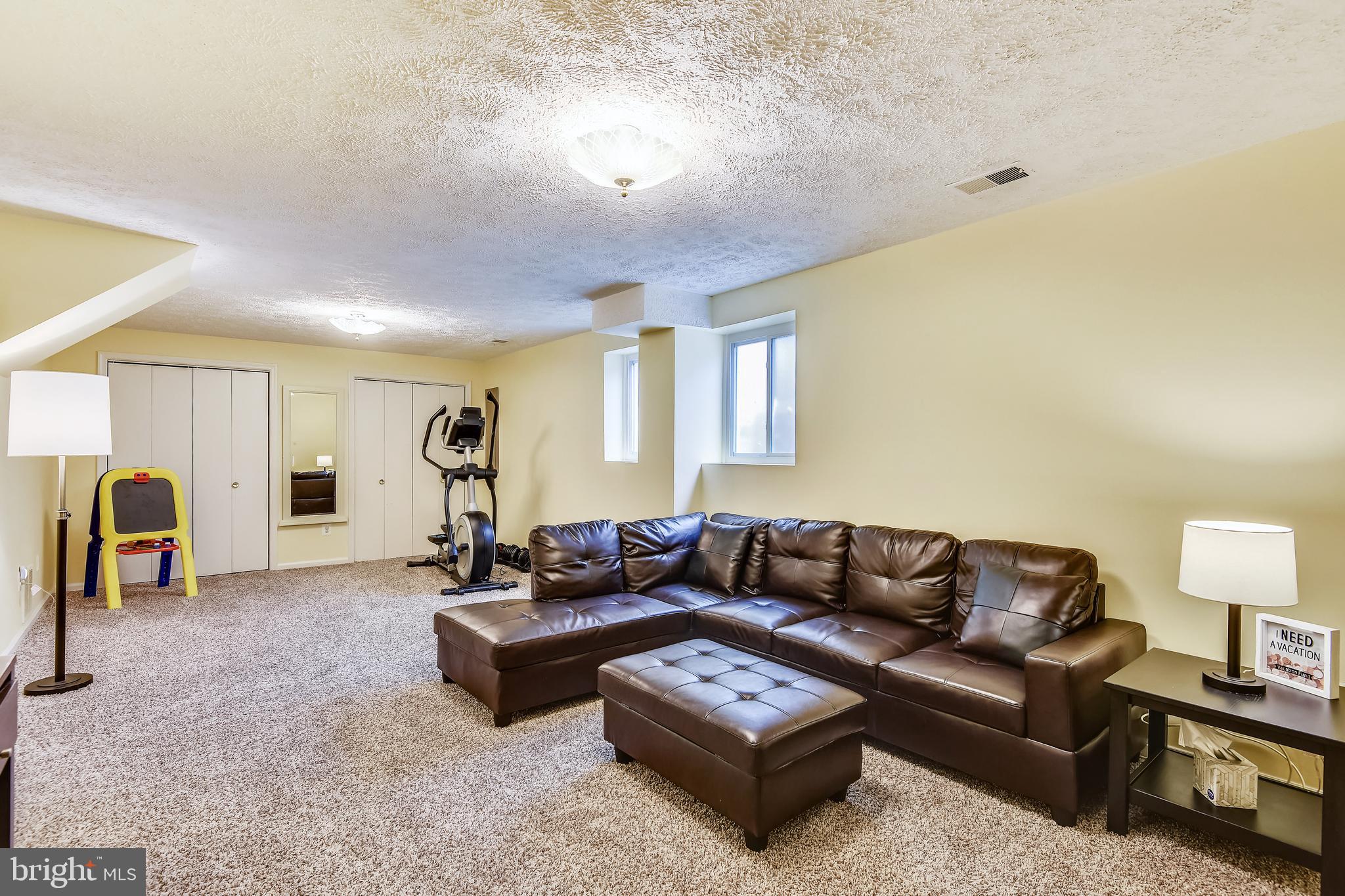 8523 Forrester Boulevard Springfield, VA 22152 - Photo 24 of 36 Lower level family room w/ wood burning fireplace