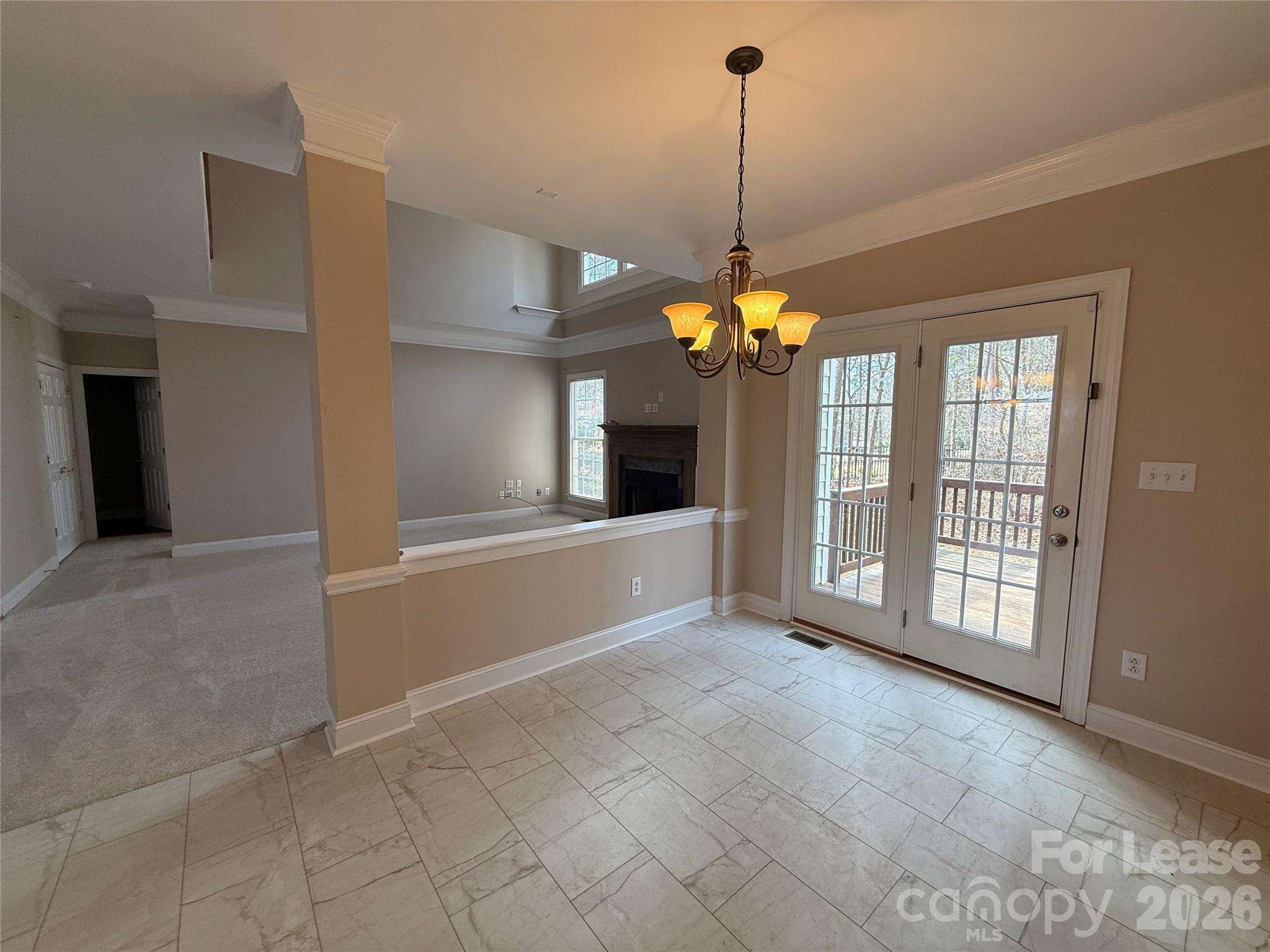 3993 Lake Shore Road South Denver, NC 28037 - Photo 11 of 39 a view of an empty room with window and chandelier