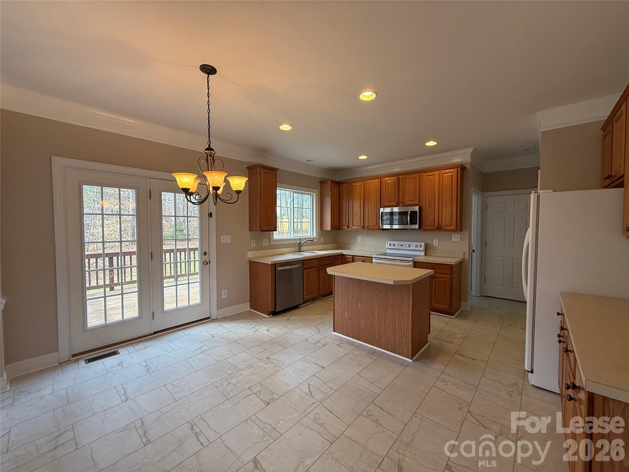 3993 Lake Shore Road South Denver, NC 28037 - Photo 12 of 39 a large kitchen with a large counter top appliances and cabinets