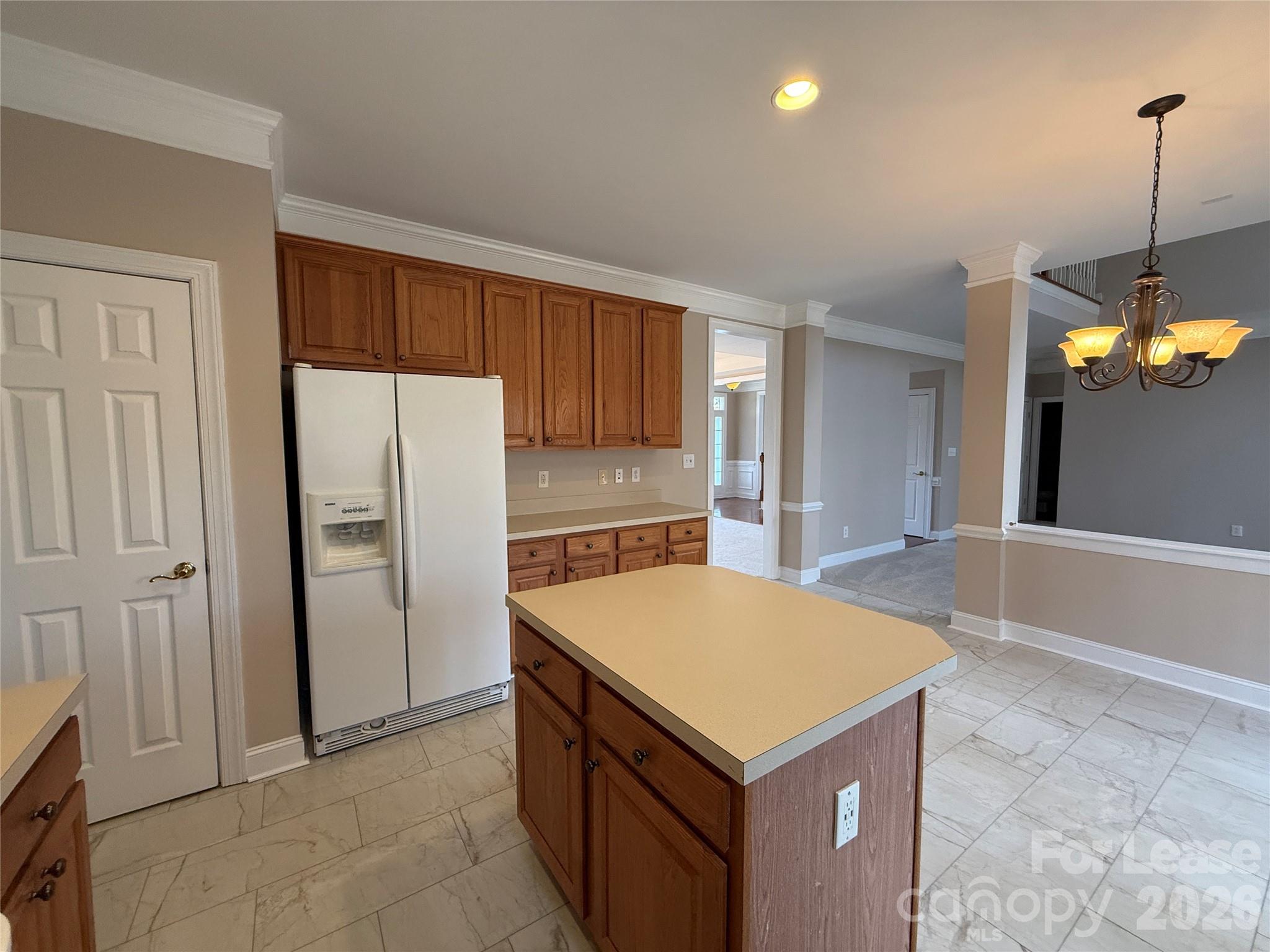 3993 Lake Shore Road South Denver, NC 28037 - Photo 16 of 39 a kitchen with a refrigerator a sink and cabinets