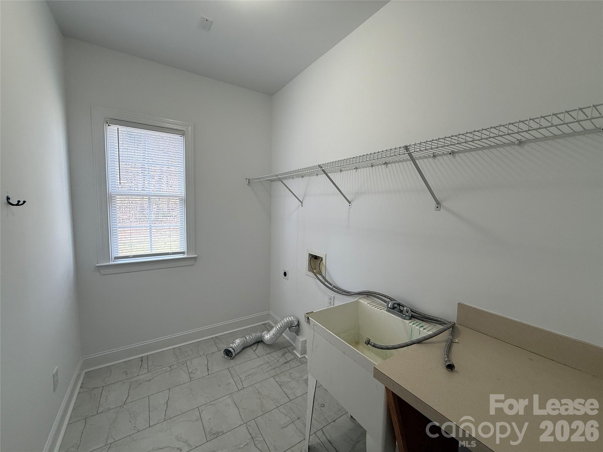 3993 Lake Shore Road South Denver, NC 28037 - Photo 18 of 39 a bathroom with a sink and a window