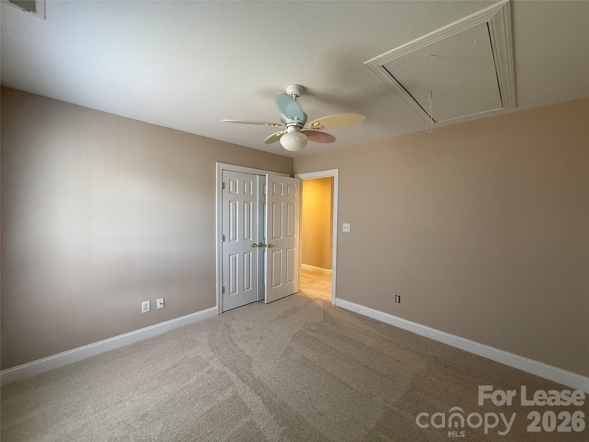 3993 Lake Shore Road South Denver, NC 28037 - Photo 37 of 39 an empty room with a ceiling fan and a window