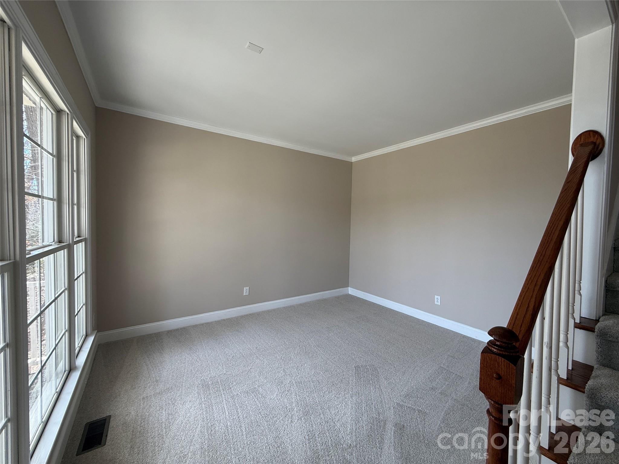 3993 Lake Shore Road South Denver, NC 28037 - Photo 7 of 39 an empty room with windows