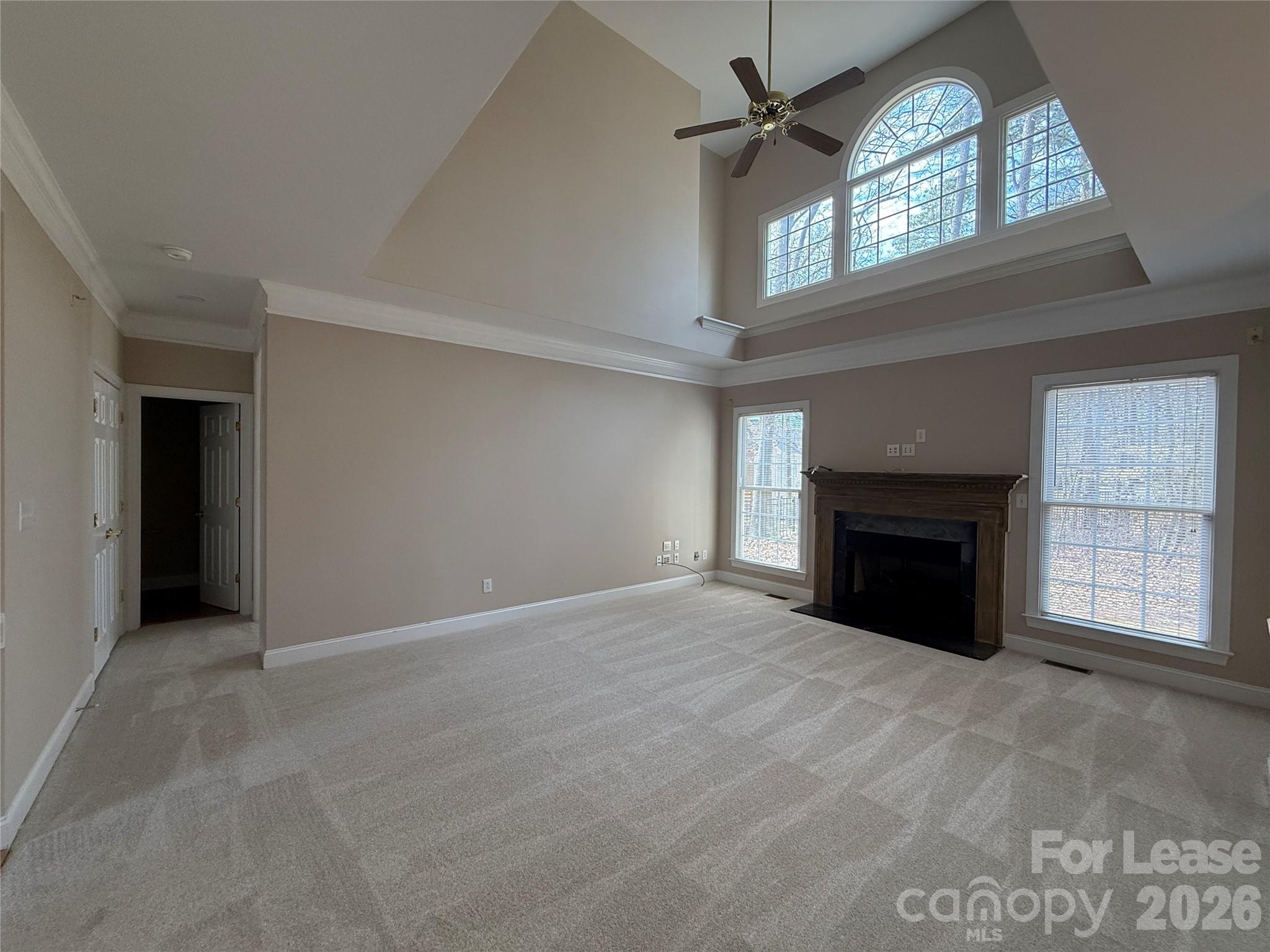 3993 Lake Shore Road South Denver, NC 28037 - Photo 10 of 39 an empty room with windows and fireplace