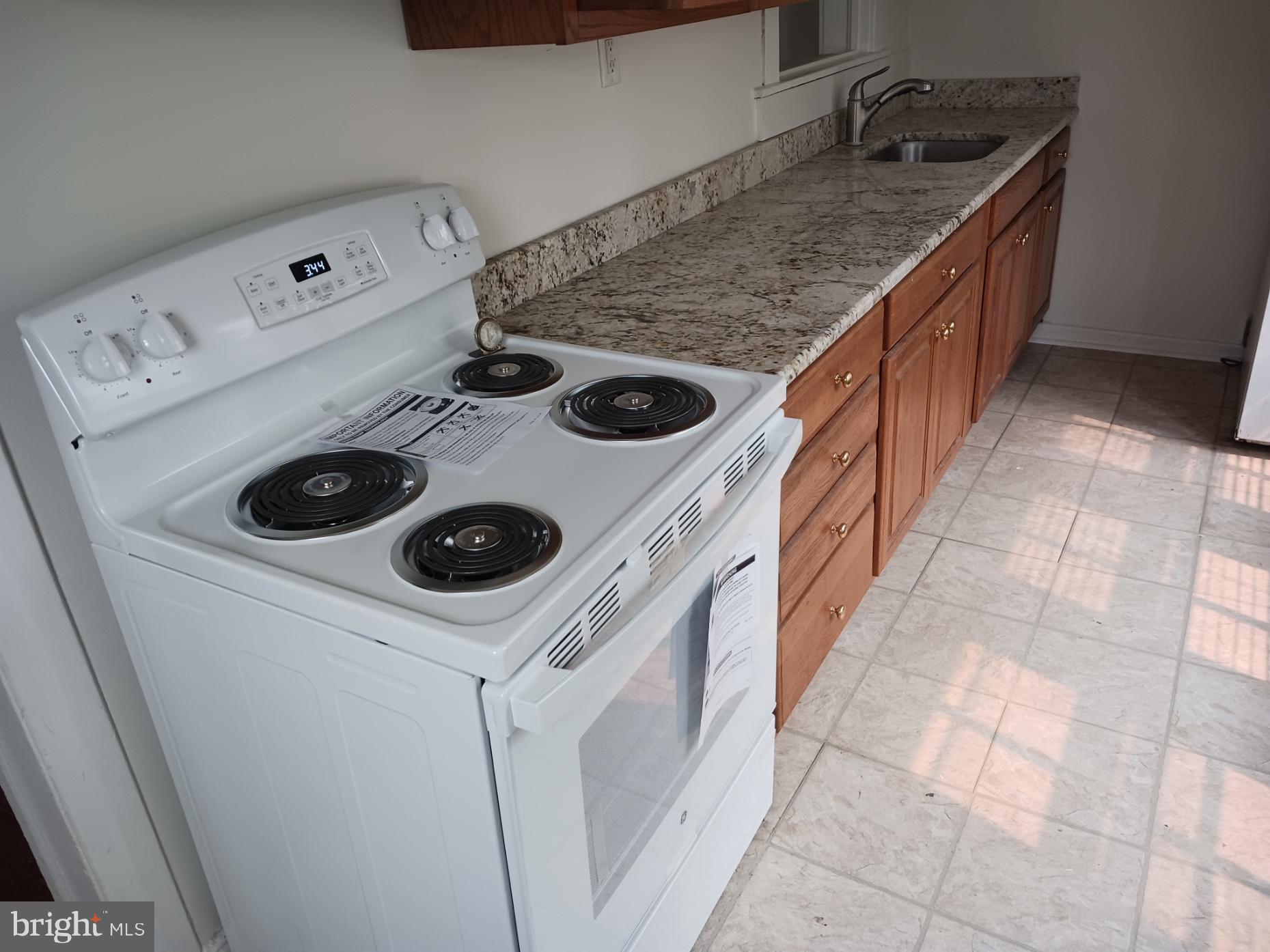 56 Darby Road, Unit 1 Paoli, PA 19301 - Photo 7 of 16 Upgraded granite kitchen. New stove.
