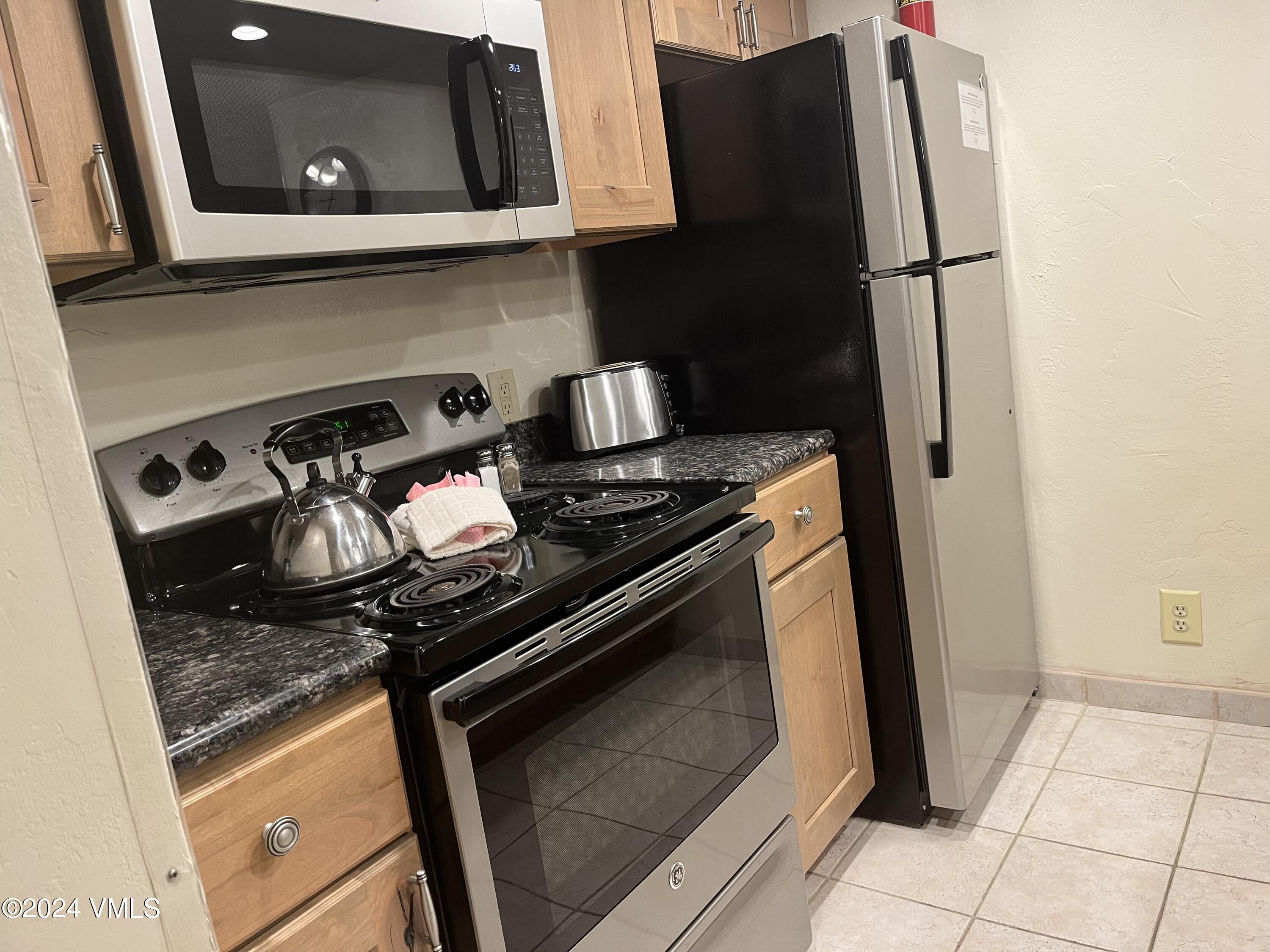 1020 Vail View Drive, Unit 311247 Vail, CO 81657 - Photo 23 of 23 a close view of a stove and refrigerator
