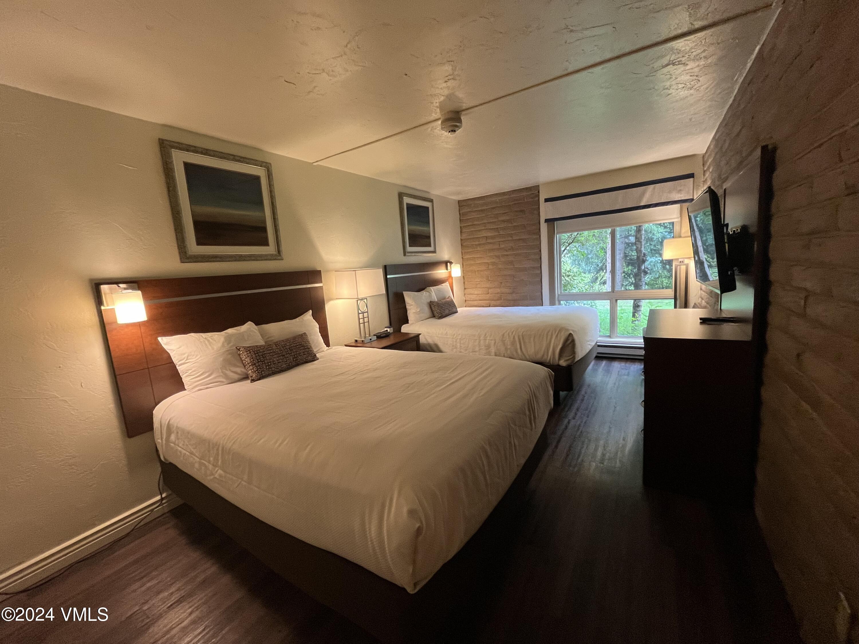 1020 Vail View Drive, Unit 311247 Vail, CO 81657 - Photo 7 of 23 a bedroom with bed and window