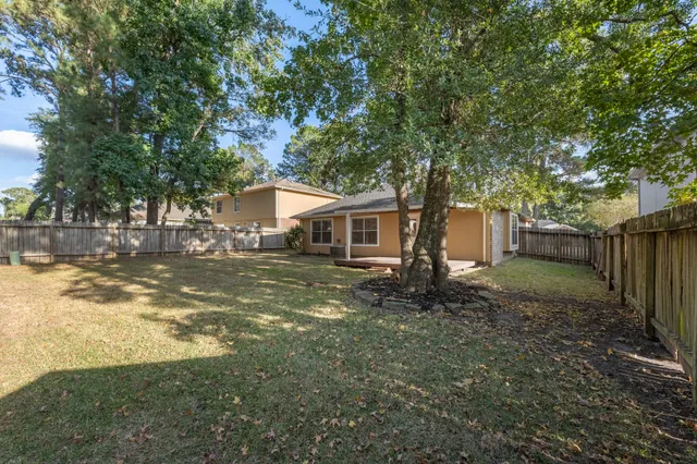 a backyard of a house with lots of green space