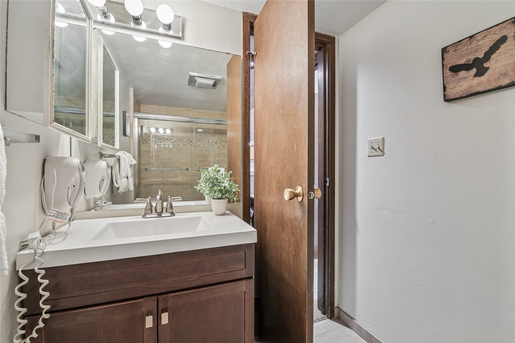 423 Wild Irishman Road, Unit 1008 1009 Keystone, CO 80435 - Photo 17 of 28 a bathroom with a sink mirror and vanity