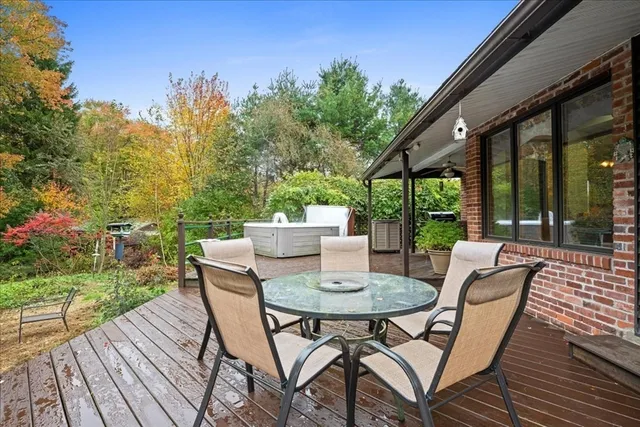 a view of a patio with a table and chairs