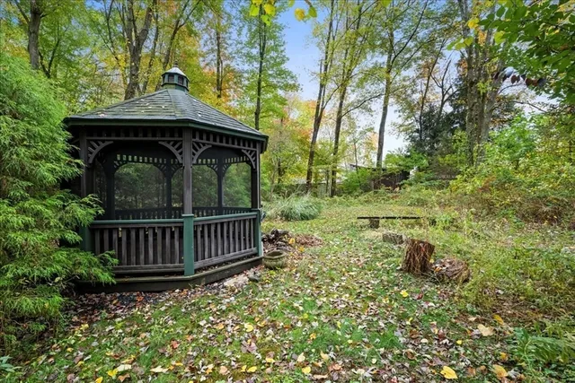 a view of a wooden deck with a yard
