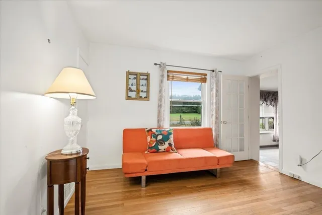 a bedroom with furniture and a window