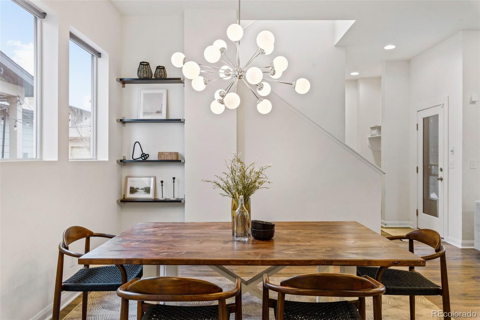 6731 Raritan Drive Denver, CO 80221 - Photo 13 of 40 a dining room with furniture and wooden floor