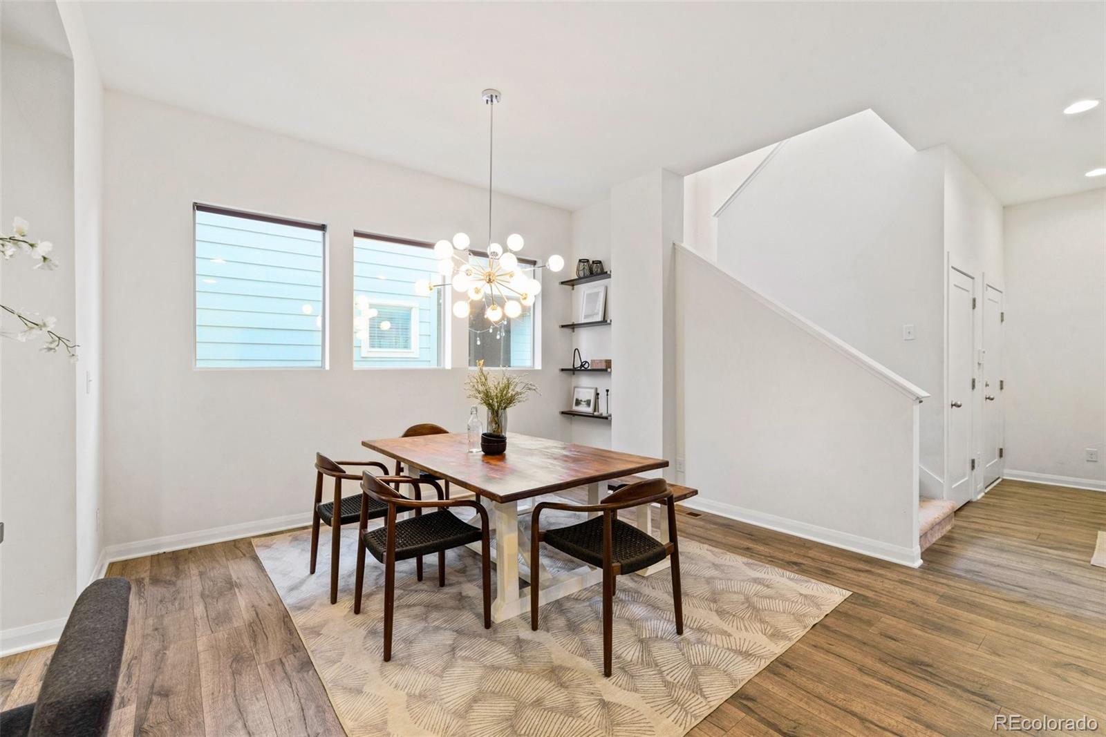6731 Raritan Drive Denver, CO 80221 - Photo 14 of 40 a view of a dining room with furniture window and wooden floor