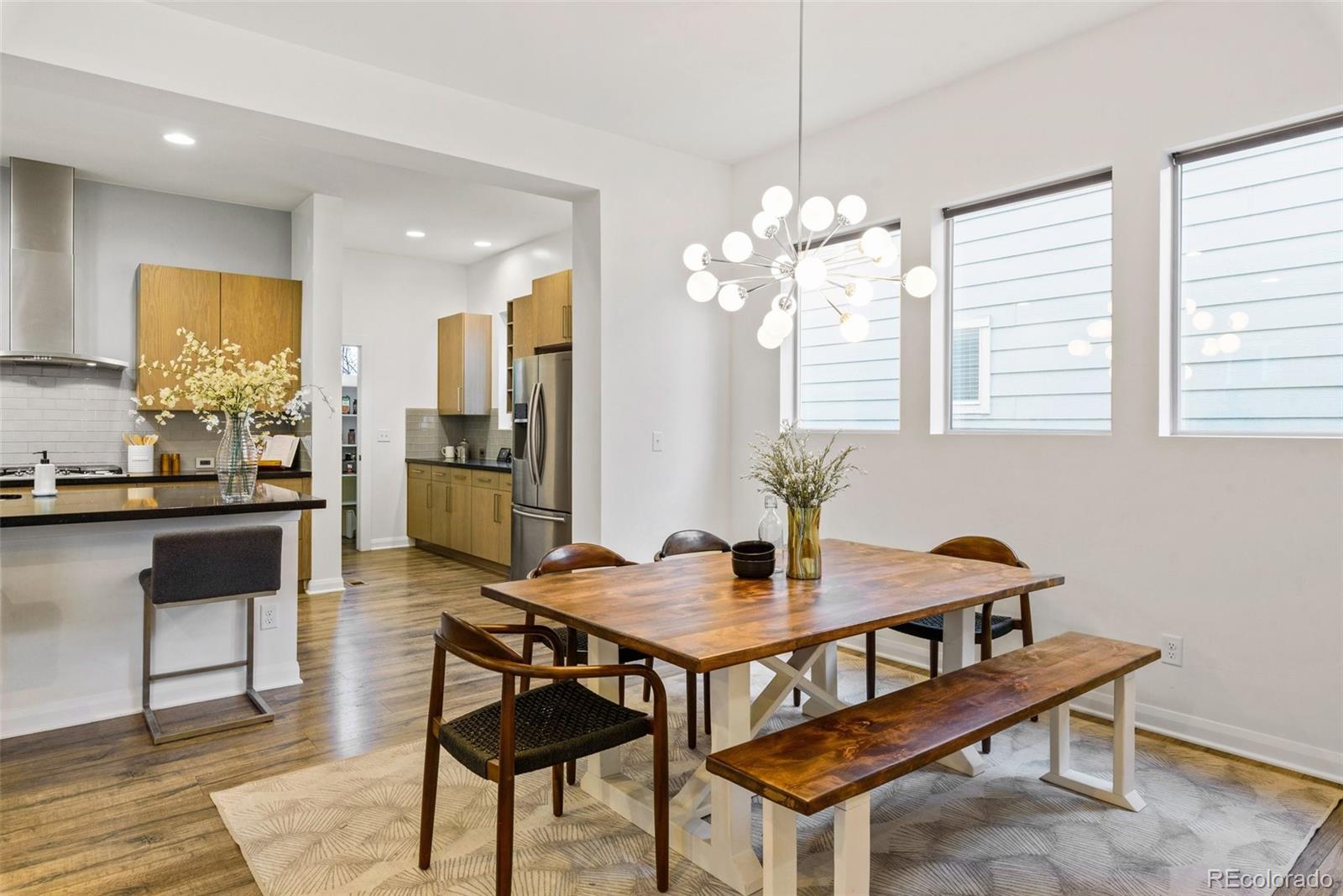 6731 Raritan Drive Denver, CO 80221 - Photo 15 of 40 a view of a dining room with furniture and window