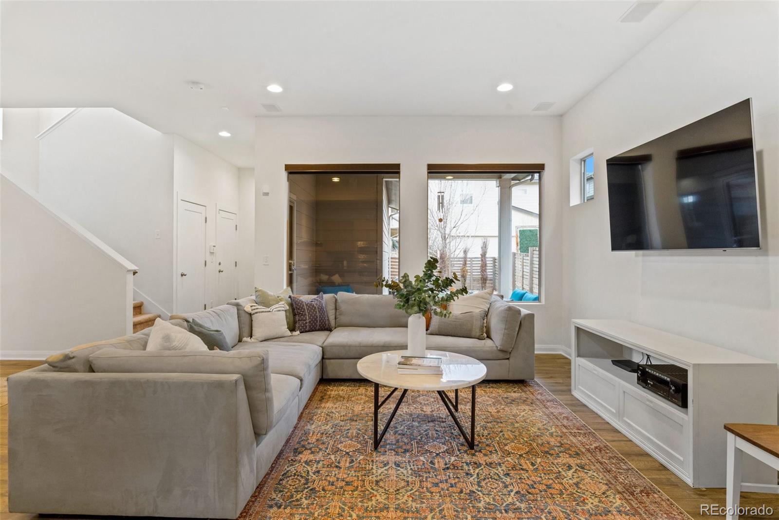 6731 Raritan Drive Denver, CO 80221 - Photo 17 of 40 a living room with furniture and a flat screen tv