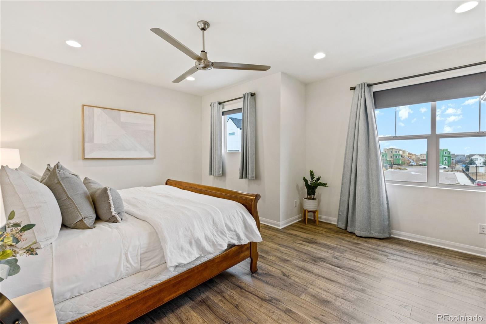 6731 Raritan Drive Denver, CO 80221 - Photo 23 of 40 a bedroom with a bed and a large window