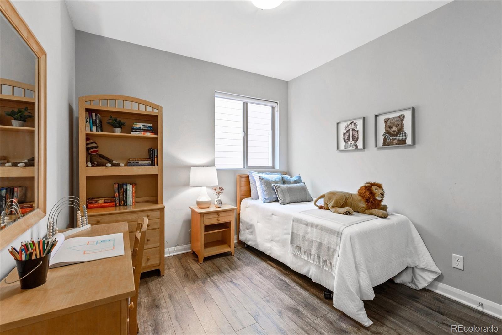 6731 Raritan Drive Denver, CO 80221 - Photo 27 of 40 a bedroom with a bed and a window