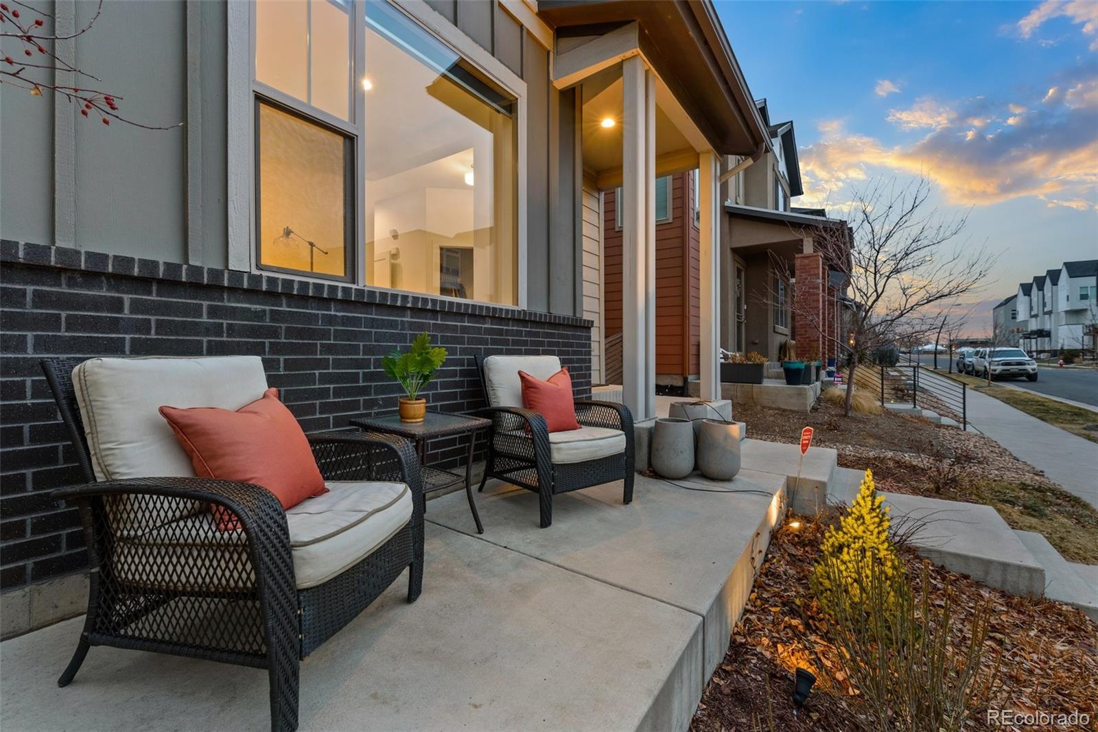 6731 Raritan Drive Denver, CO 80221 - Photo 3 of 40 a view of a patio with couches table and chairs and potted plants