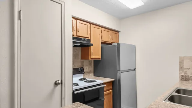 a bathroom with a toilet and a view of bathroom