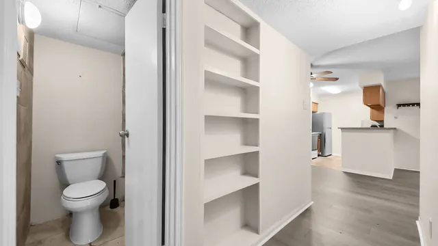 a bathroom with a bathtub and a toilet