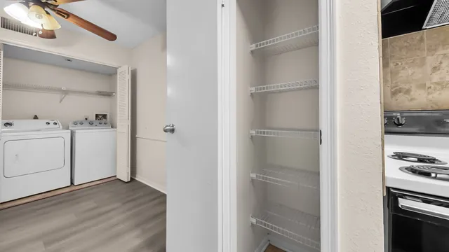 a kitchen with a stove and a refrigerator