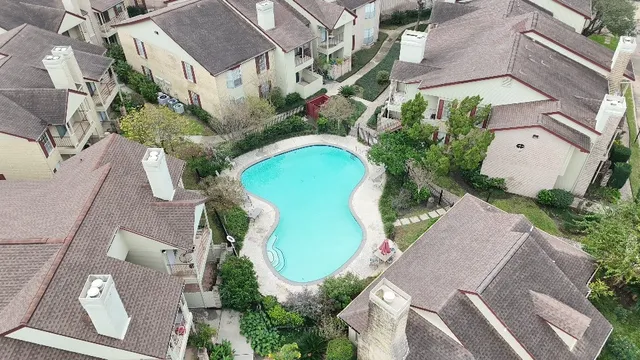 an aerial view of a house with outdoor space
