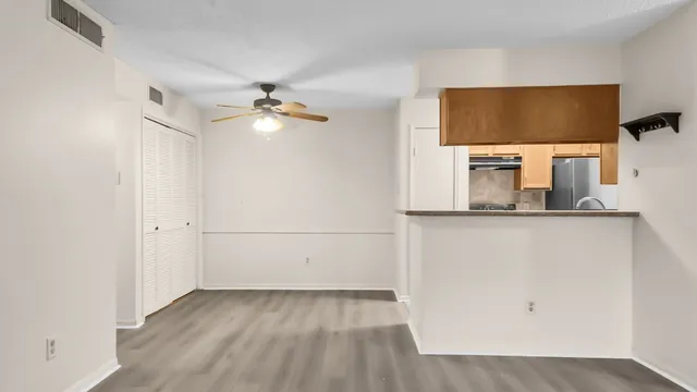 a view of a livingroom with wooden floor