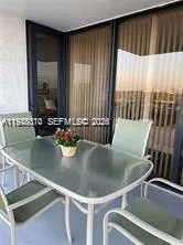 a view of kitchen with kitchen island a sink and a table