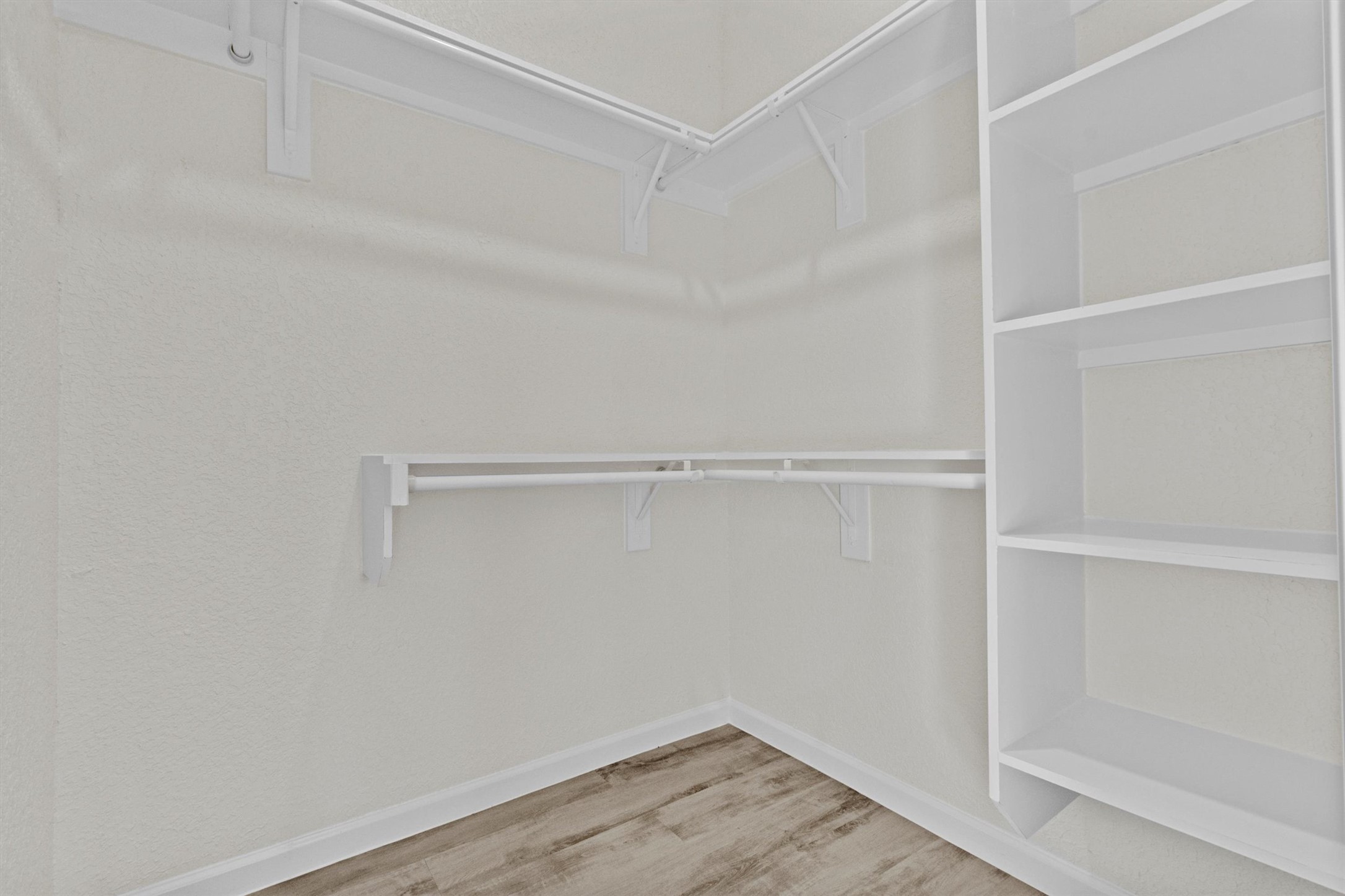 408 Griffin Street Luling, TX 78648 - Photo 26 of 34 Spacious closet with wood finished floors