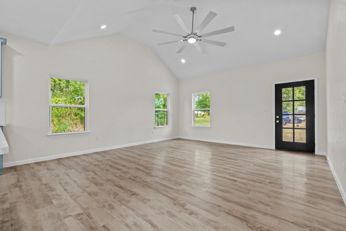 408 Griffin Street Luling, TX 78648 - Photo 6 of 33 an empty room with window and a ceiling fan
