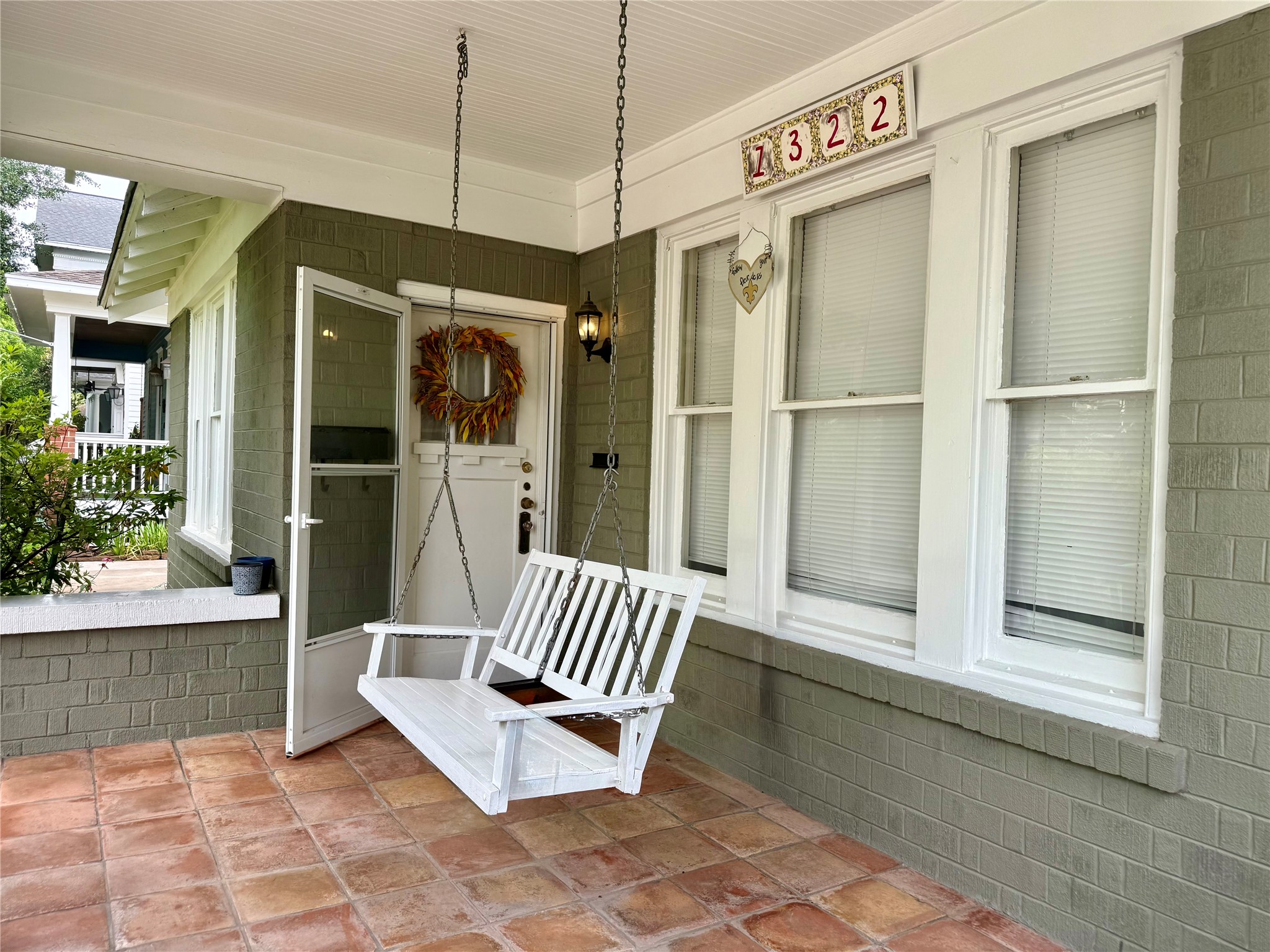 1322 Harvard Street Houston, TX 77008 - Photo 2 of 19 Relaxing front porch overlooks the tranquil yard. Porch swing truly defines Heights living.