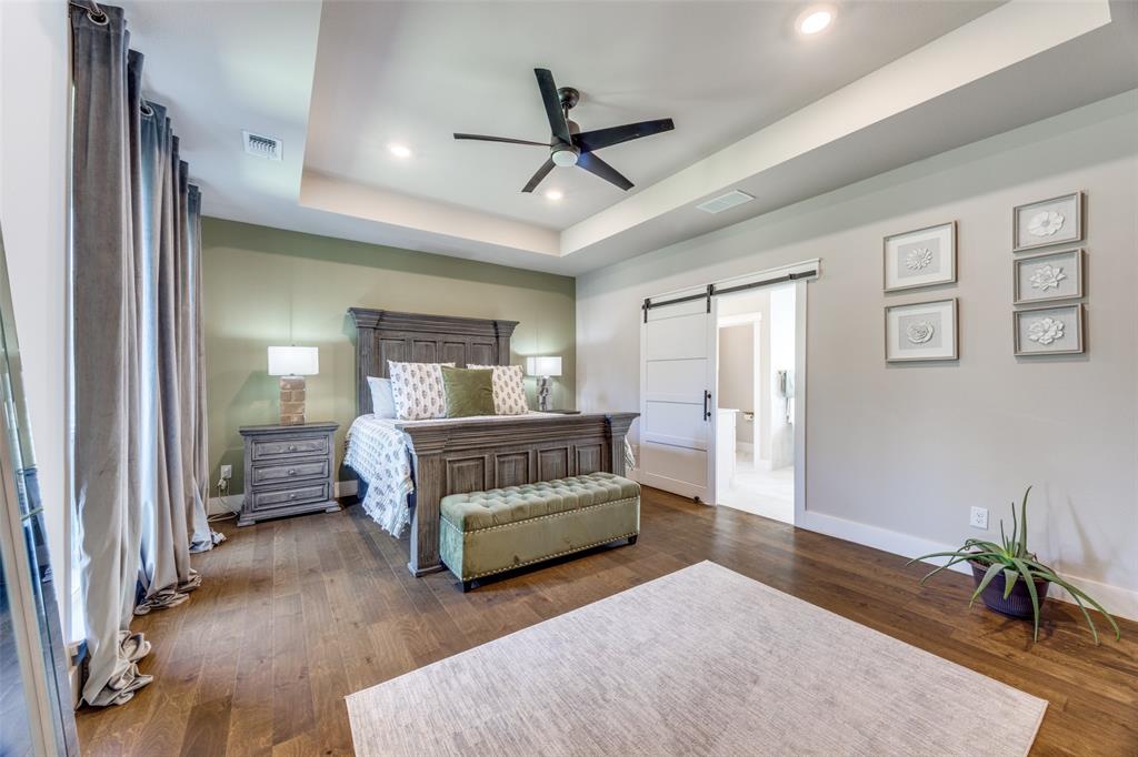 9425 Dripping Springs Road Denison, TX 75021 - Photo 14 of 39 a bedroom with a bed and window