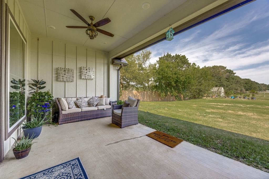 9425 Dripping Springs Road Denison, TX 75021 - Photo 33 of 39 a outdoor living space with furniture and garden view