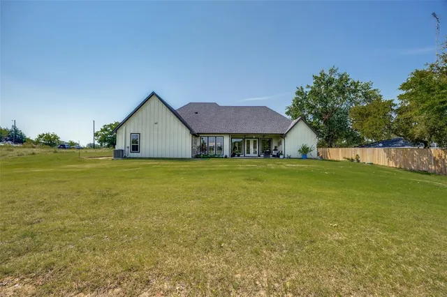 a view of a field with an ocean