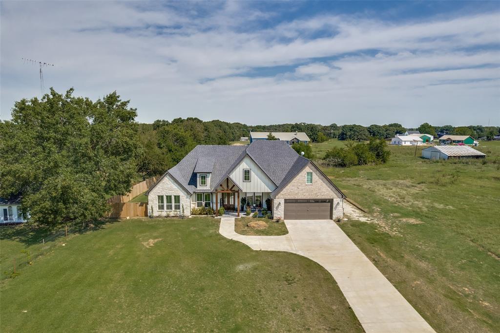9425 Dripping Springs Road Denison, TX 75021 - Photo 36 of 39 a view of house with garden