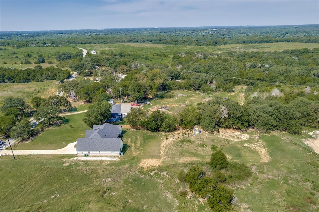 9425 Dripping Springs Road Denison, TX 75021 - Photo 37 of 39 a view of a city with lush green forest