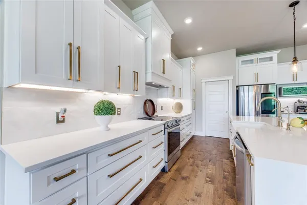 a spacious bathroom with a double vanity sink and a mirror