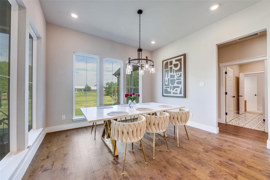 9425 Dripping Springs Road Denison, TX 75021 - Photo 6 of 39 a view of a dining room with furniture window and wooden floor