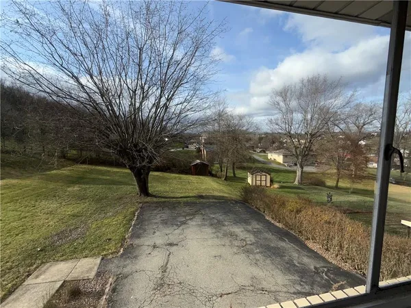 a view of a yard with an outdoor space