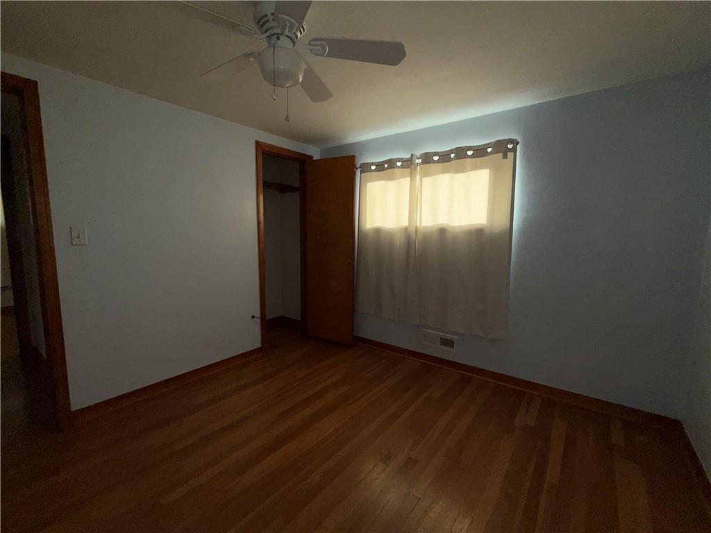 151 Thorne Road Washington, PA 15301 - Photo 9 of 23 an empty room with wooden floor and windows