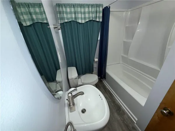 a bathroom with a sink and toilet