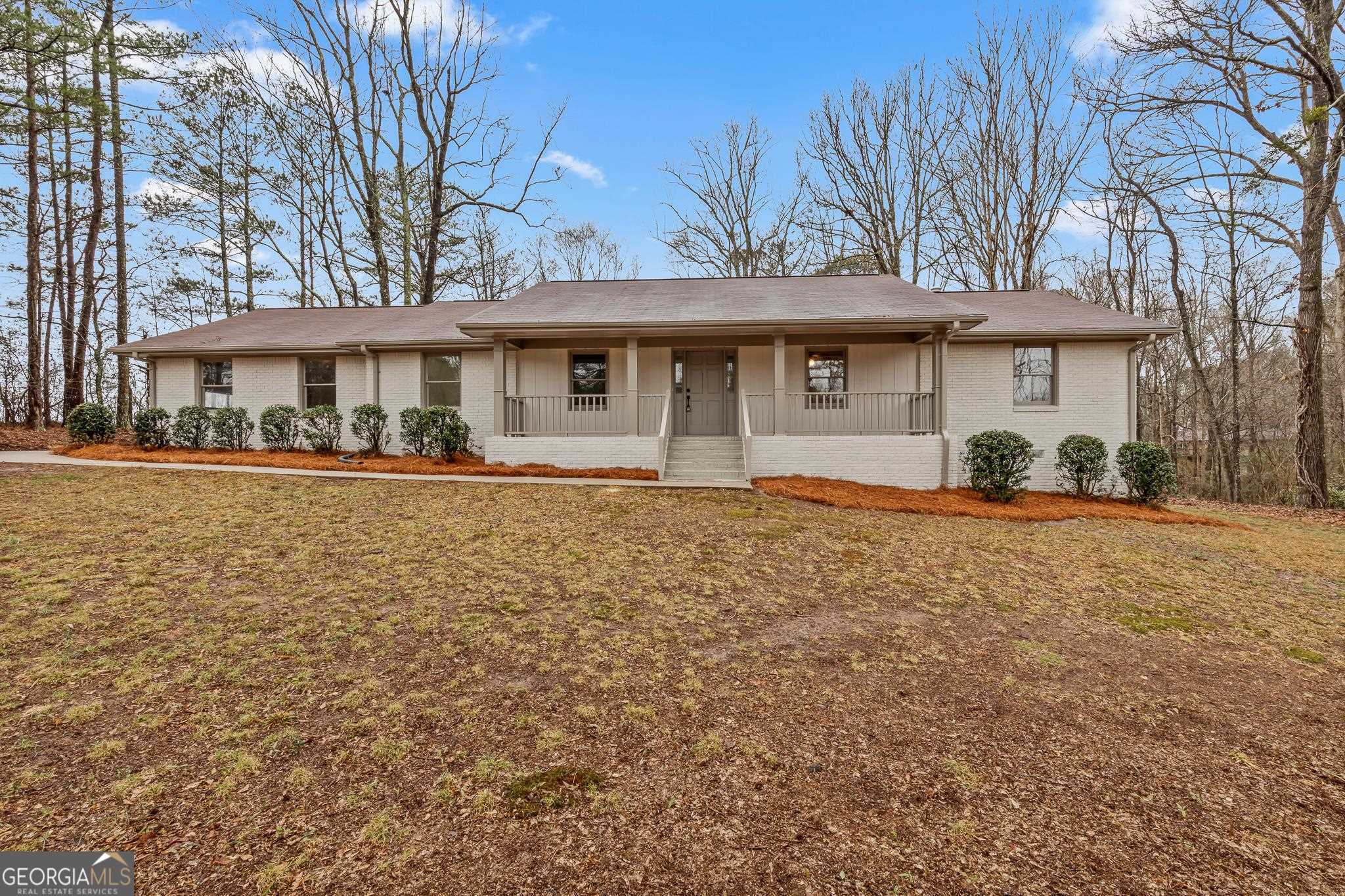 125 Strawberry Lane Tyrone, GA 30290 - Photo 1 of 1 a front view of a house with a garden