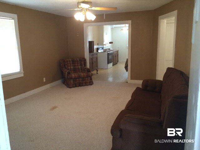 9460 Celeste Road Saraland, AL 36571 - Photo 6 of 13 Looking from living room entry back and into kitchen/dining.