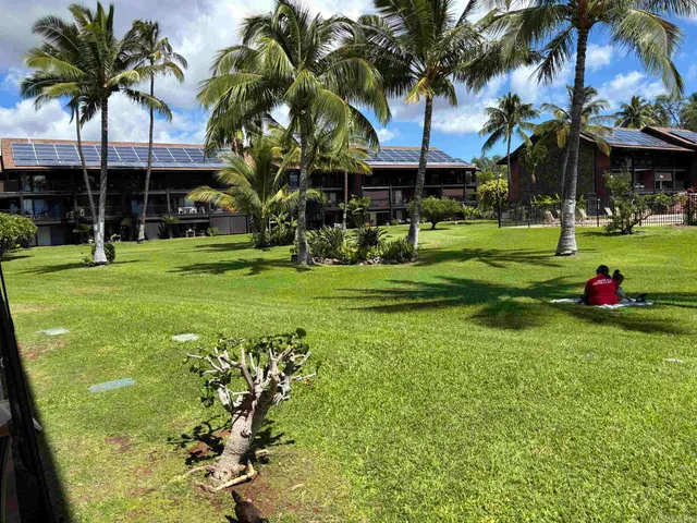 a view of a park with swings and slides