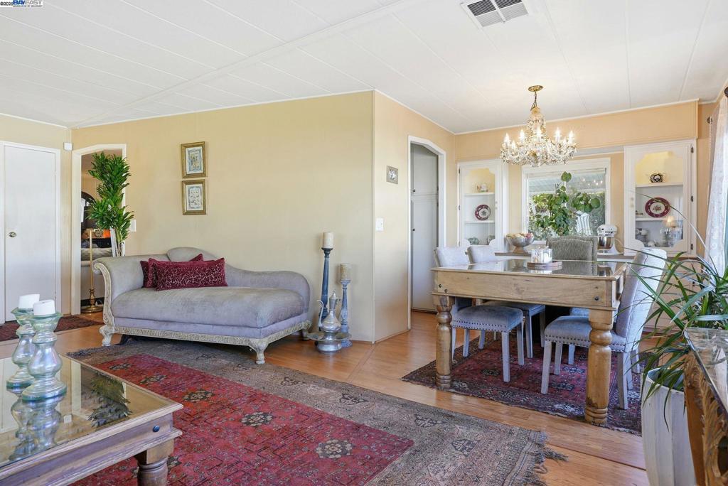 4141 Deep Creek Road Fremont, CA 94555 - Photo 11 of 54 a living room with furniture and a chandelier