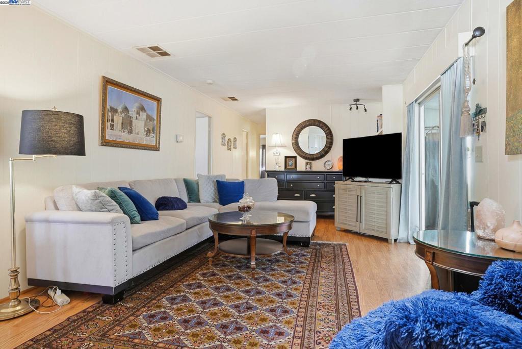 4141 Deep Creek Road Fremont, CA 94555 - Photo 13 of 54 a living room with furniture and a flat screen tv