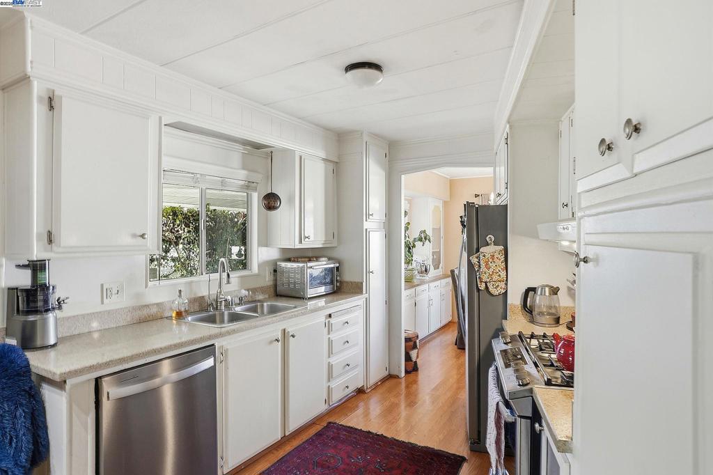 4141 Deep Creek Road Fremont, CA 94555 - Photo 17 of 54 a kitchen with stainless steel appliances granite countertop a sink stove and refrigerator
