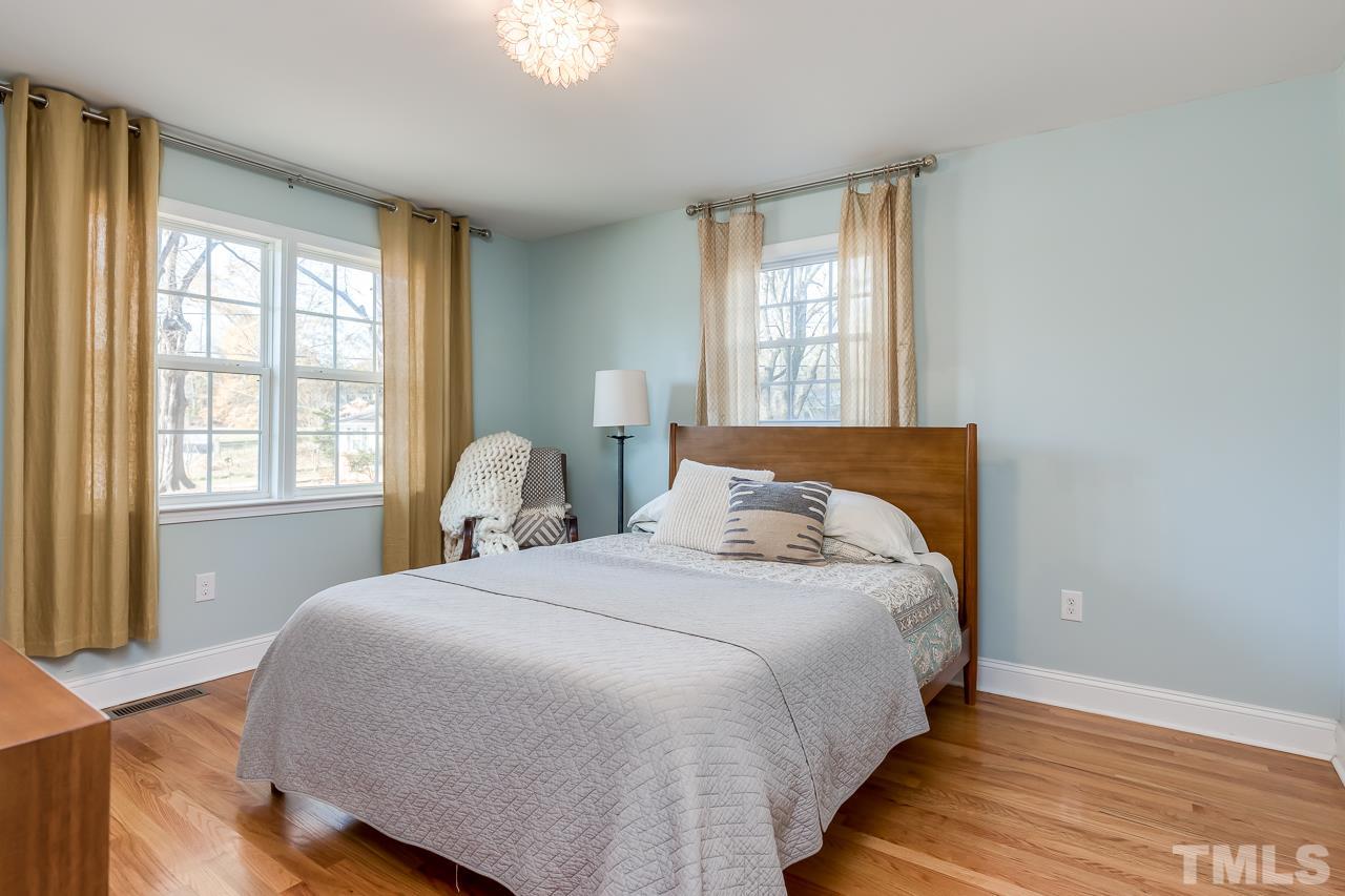 2411 Boswell Road Raleigh, NC 27610 - Photo 14 of 26 a bedroom with a bed and window